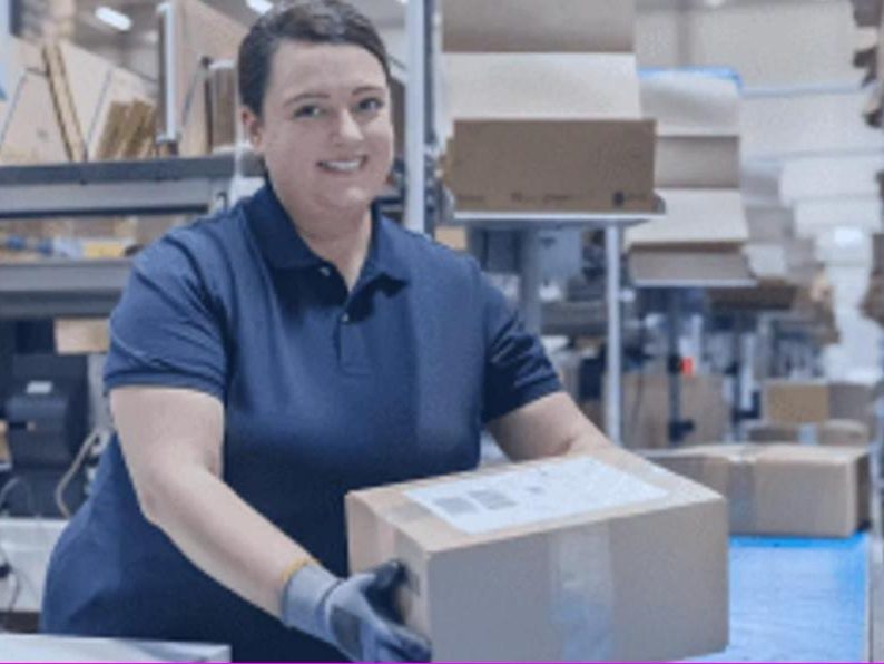 Shelf Cloud team member packing a customer order in the warehouse