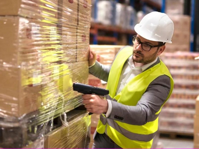 Operator scanning pallets for an Amazon FBA shipment