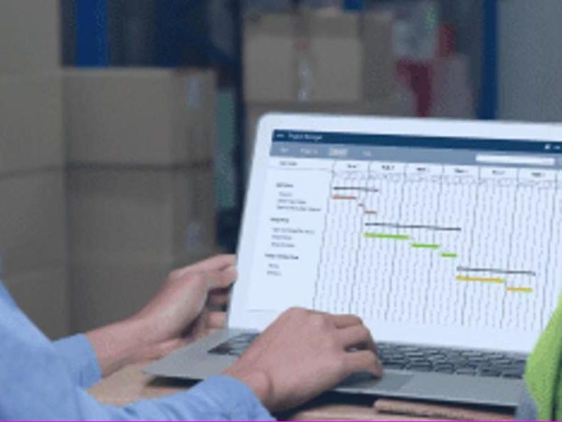 Shelf Cloud staff reviewing live order data on the warehouse floor